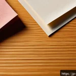 종이의 색상과 질감 - A close-up image of various types of paper textures arranged artistically on a wooden table, featuri...